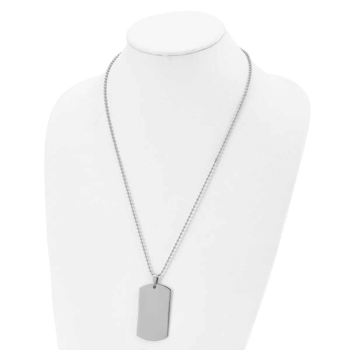 Silver-toned rectangular dog tag pendant hanging from a thin chain necklace, displayed on a white mannequin bust.