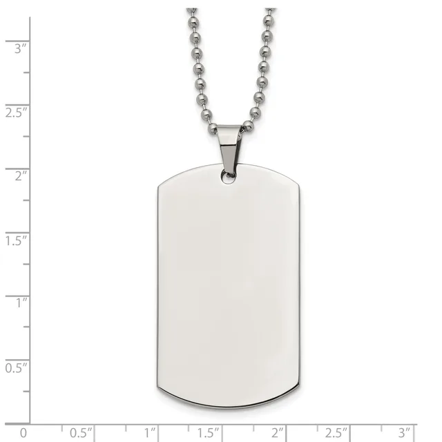 A blank rectangular metal dog tag pendant with rounded corners hangs from a ball chain necklace, shown against a measurement scale.