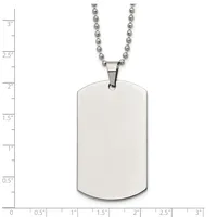 A blank rectangular metal dog tag pendant with rounded corners hangs from a ball chain necklace, shown against a measurement scale.