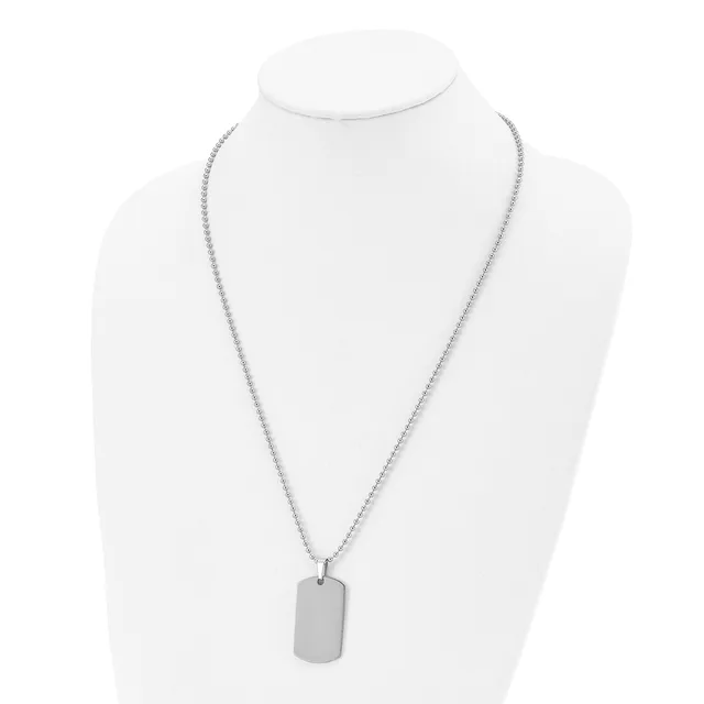 A silver-toned stainless steel necklace with a box chain and rectangular dog tag pendant displayed on a white bust form.