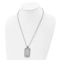 A silver-toned rectangular dog tag pendant hangs from a thin box chain necklace displayed on a white mannequin bust.
