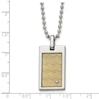 Stainless steel rectangular pendant with gold-colored wave pattern and small diamond accent, suspended from a ball chain, shown against a measurement scale.