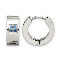 A pair of polished silver huggie earrings with square settings containing four small blue gemstones displayed side by side.