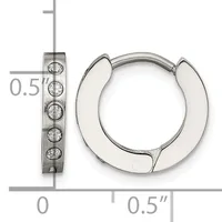 A pair of polished silver huggie hoop earrings with textured rectangular posts set with small round stones, shown next to a ruler for scale.