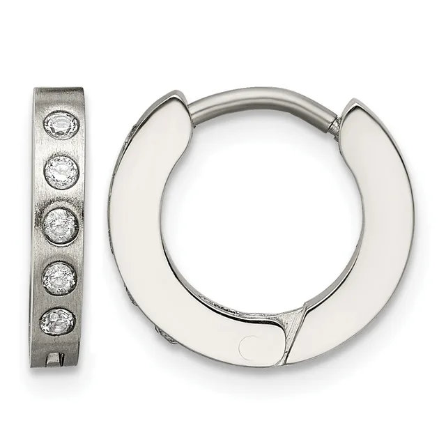 A pair of silver hoop earrings with a brushed finish and five round cubic zirconia stones set along one flat rectangular earring, displayed open.