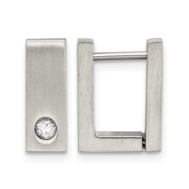 A pair of rectangular silver-toned hoop earrings, one featuring a round clear crystal stone set into the flat surface.