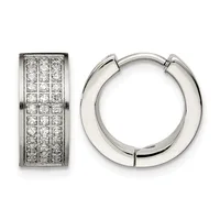 Two silver-toned metal earrings: on the left, a rectangular huggie with pave-set round diamonds in a grid pattern; on the right, a polished chunky hoop with a hinged closure.