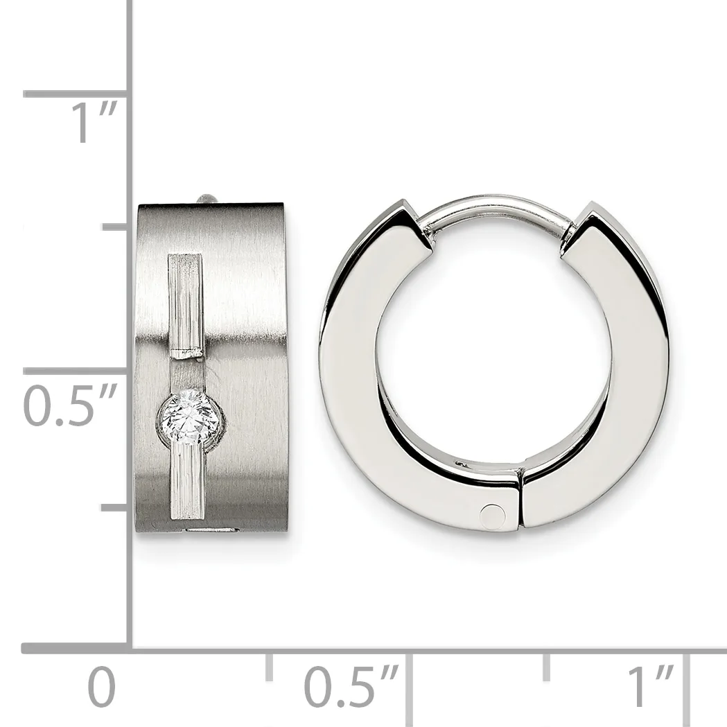 Two silver earrings displayed against a ruler: a rectangular hinged huggie with a center diamond, and a polished chunky hoop, each approximately 0.5 inches wide.