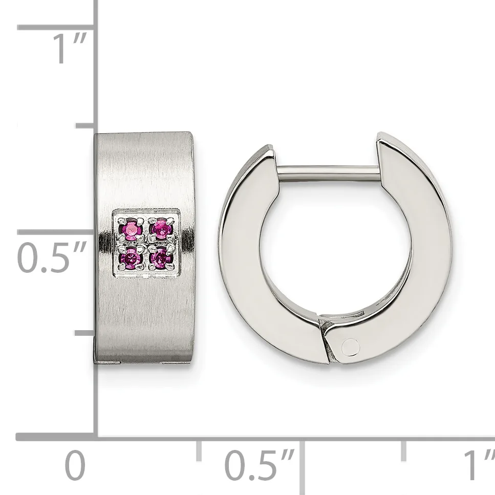 Pair of silver huggie earrings with brushed finish and small square settings containing four pink gemstones, shown with measurement scale.