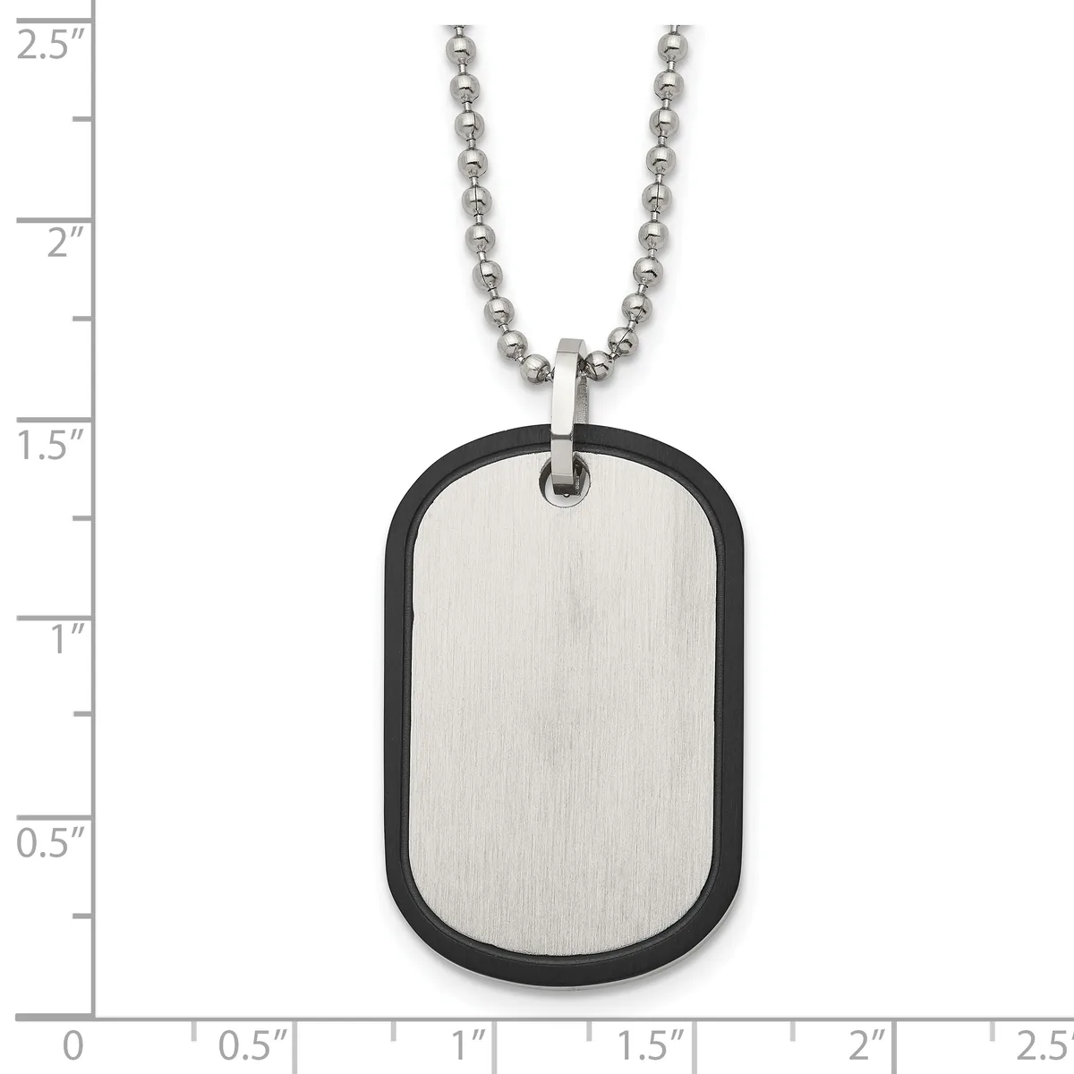 Stainless steel dog tag pendant with black rubber trim on a ball chain, shown against a measurement scale indicating the tag is approximately 1.5 inches tall.