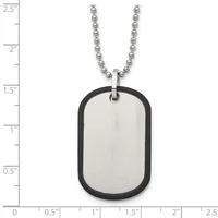 Stainless steel dog tag pendant with black rubber trim on a ball chain, shown against a measurement scale indicating the tag is approximately 1.5 inches tall.