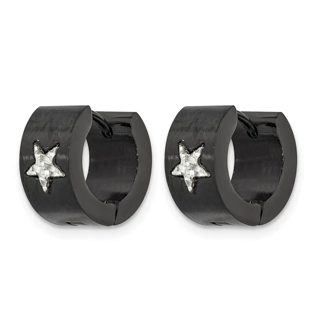 A pair of black huggie hoop earrings with white star designs on the outer surface, shown from the front.
