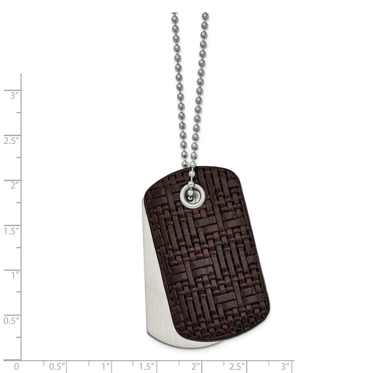 Dog tag pendant with textured dark brown front face and brushed silver back, suspended from a ball chain, shown against a measurement scale.