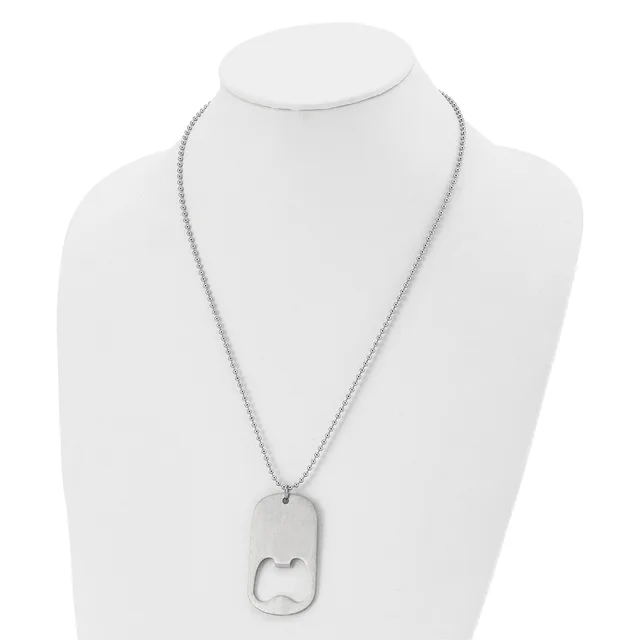 Silver-toned stainless steel dog tag necklace with rounded rectangular pendant featuring a cutout design, displayed on a white mannequin bust.