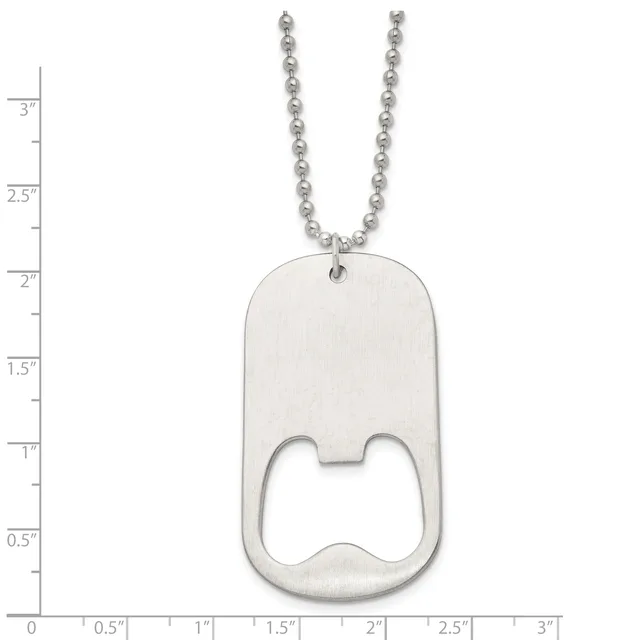 A stainless steel dog tag pendant with a bottle opener cutout, suspended from a ball chain, displayed against a measurement ruler.