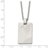A rectangular stainless steel pendant with a brushed finish hangs from a box chain necklace, displayed against a measurement scale.