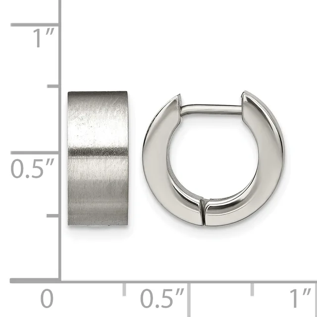 Two polished silver-toned chunky hoop earrings displayed next to a ruler showing approximately half-inch width and one-inch height.