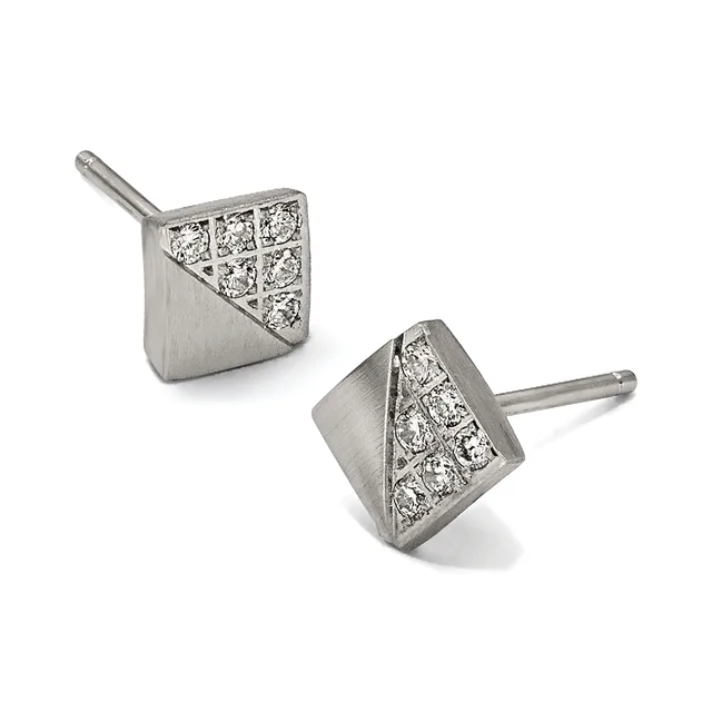 A pair of square stud earrings in white metal with diamond pavé inlay on the upper half and brushed finish on the lower half, shown from two angles on posts.