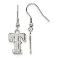 A pair of silver-toned dangle earrings with hook-and-ball posts, each featuring a large capital letter T pendant with a textured finish.
