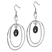 A pair of silver-toned dangle earrings with double oval rings and black oval gemstone centers, suspended from fish hook ear wires.