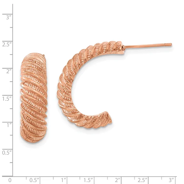 Two rose gold textured hoop earrings displayed next to a ruler showing measurements up to three inches.