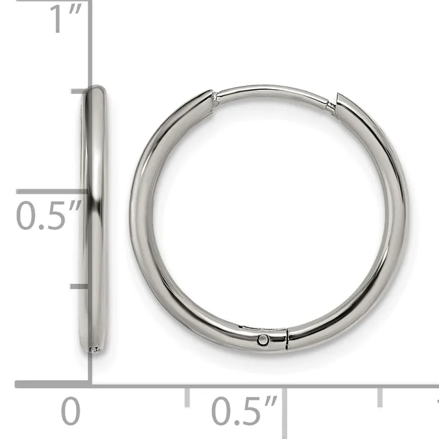 Silver-toned hinged hoop earrings shown from front and side view with measurement scale indicating approximately one inch in diameter and half inch in thickness.