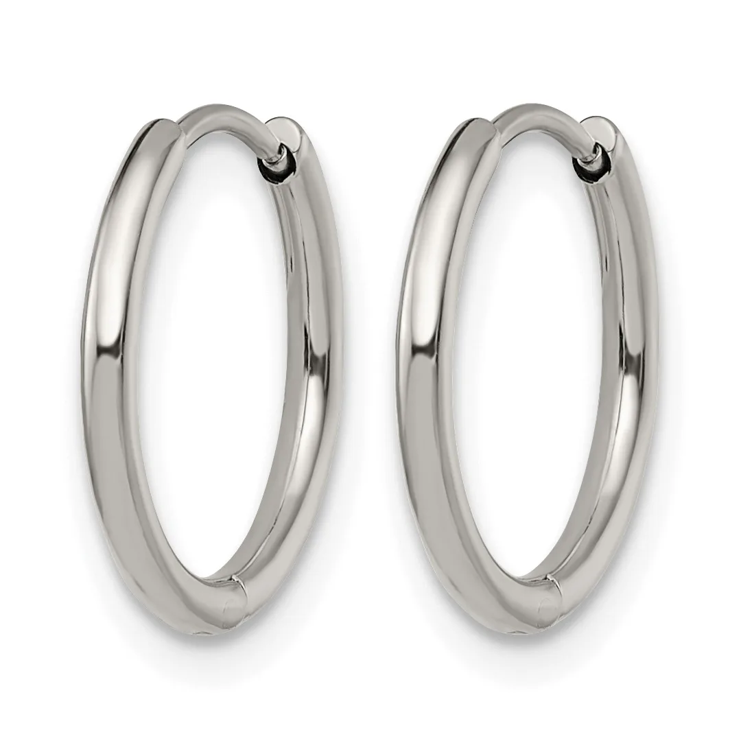 A pair of polished silver-toned chunky hoop earrings with hinged closures, shown against a white background.