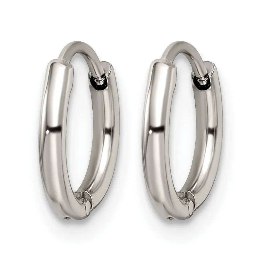 A pair of polished silver-toned chunky hoop earrings with hinged closures, displayed against a white background.