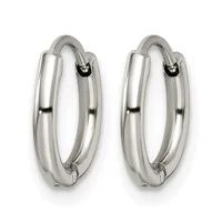 A pair of polished silver-toned chunky hoop earrings with hinged closures, displayed against a white background.