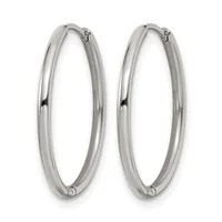 A pair of polished silver-toned oval hoop earrings with hinged closures, shown against a white background.