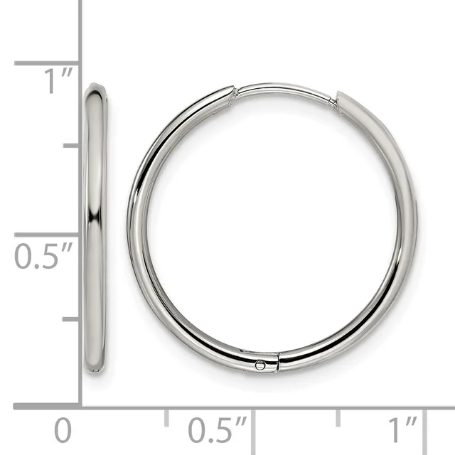 A pair of polished silver-toned hinged bangle bracelets displayed next to a ruler showing approximately one inch in diameter.