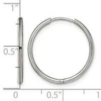 Silver-toned hollow hoop earring shown from front and side view with a measurement scale indicating approximately one inch in diameter and half inch in thickness.