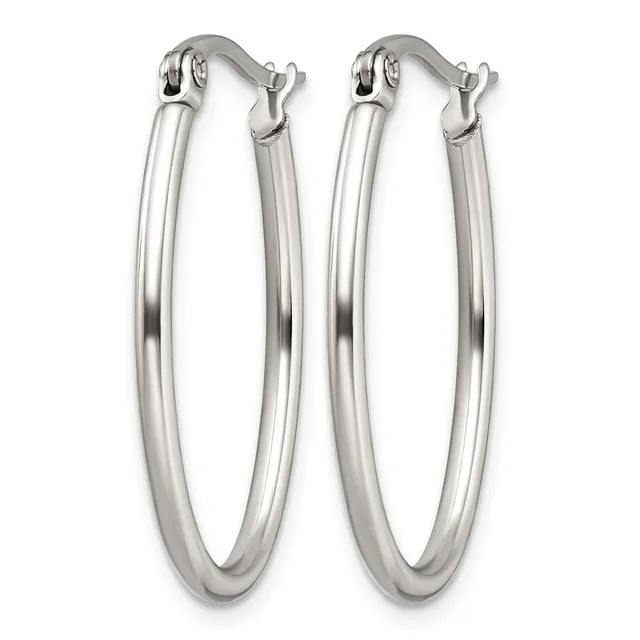 A pair of polished silver-toned oval hoop earrings with hinged closures, shown against a white background.