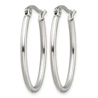 A pair of polished silver-toned oval hoop earrings with hinged closures, shown against a white background.