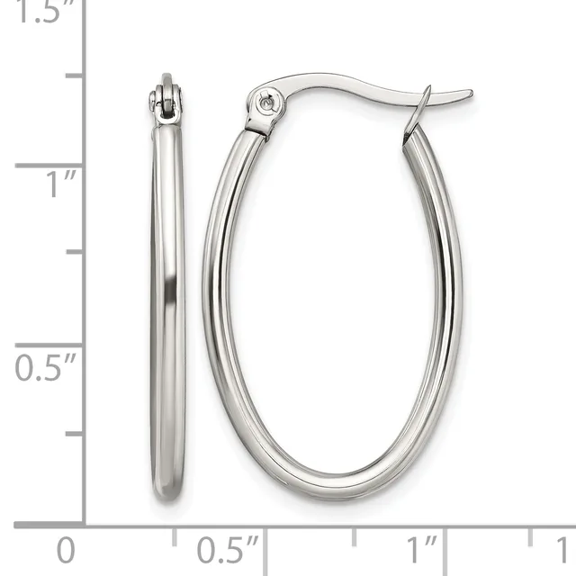 A pair of polished silver-toned oval hoop earrings with hinged closures, displayed next to a measurement scale showing they are approximately one inch tall and half an inch wide.