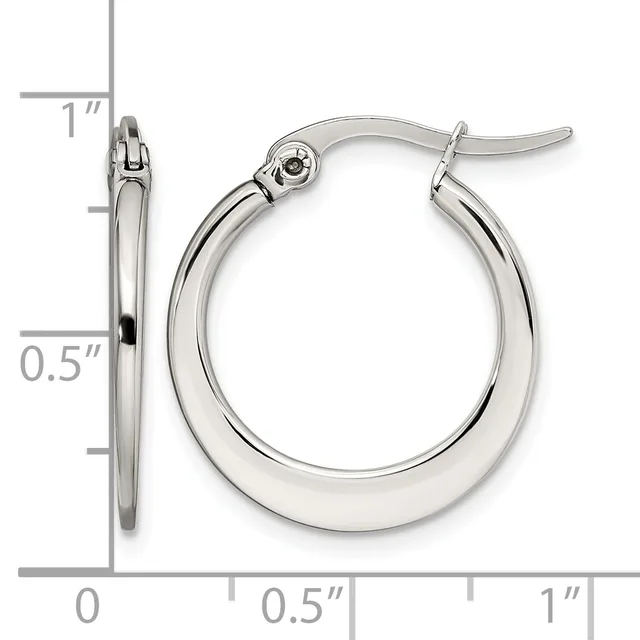 A pair of polished silver-toned hoop earrings with hinged closures, shown next to a ruler indicating they measure approximately one inch in diameter.