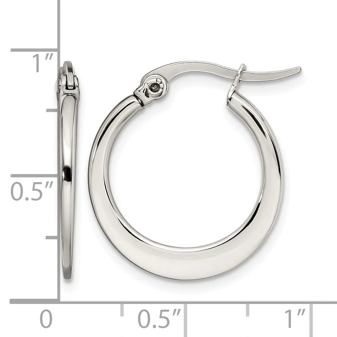 A pair of polished silver-toned hoop earrings with hinged closures, shown next to a ruler indicating they measure approximately one inch in diameter.
