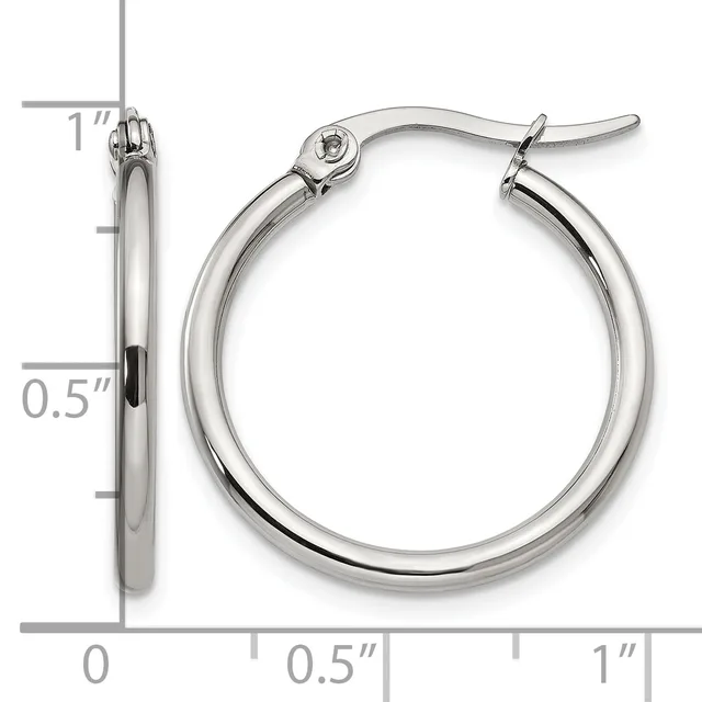 A pair of polished silver-toned hoop earrings with a measurement scale showing they are approximately one inch in diameter.