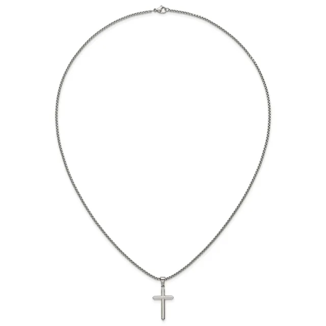 Silver chain necklace with a small cross pendant hanging from the center.