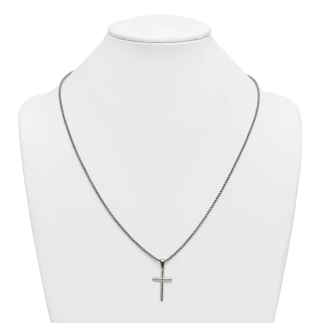 Silver-toned chain necklace with a small cross pendant displayed on a white mannequin bust.