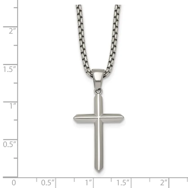 A stainless steel cross pendant on a box chain necklace, displayed against a measurement ruler showing the pendant is approximately one inch wide and one inch tall.