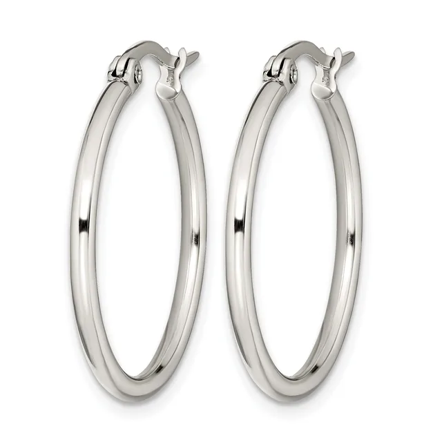 A pair of polished silver-toned hoop earrings with a smooth, rounded profile and hinged closure posts, displayed against a white background.