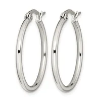 A pair of polished silver-toned hoop earrings with a smooth, rounded profile and hinged closure posts, displayed against a white background.