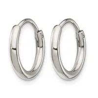 A pair of polished silver-toned hoop earrings with a chunky, rounded profile and hinged closures, displayed against a white background.