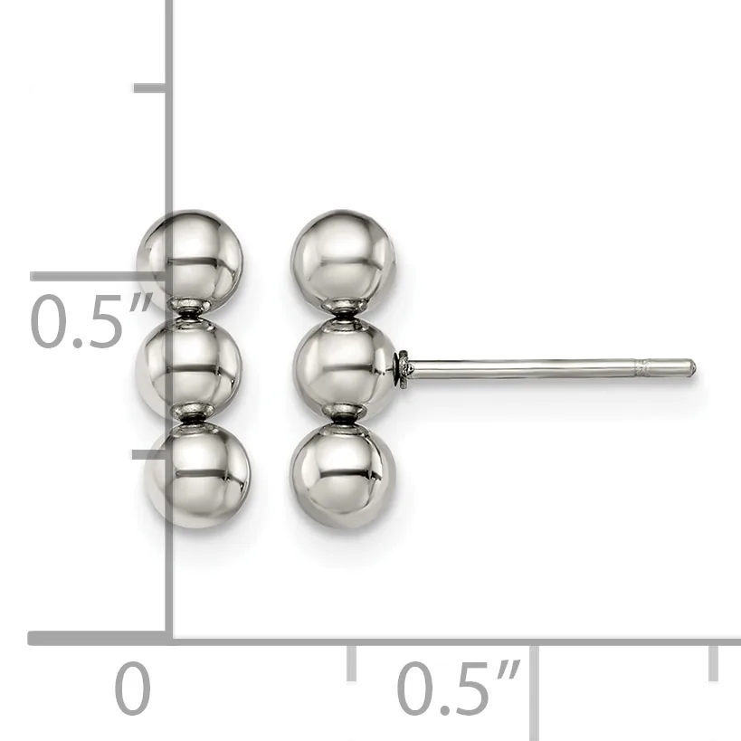 A pair of silver stud earrings featuring three stacked spheres on each post, displayed on a measurement grid showing approximately 0.5 inches in height.