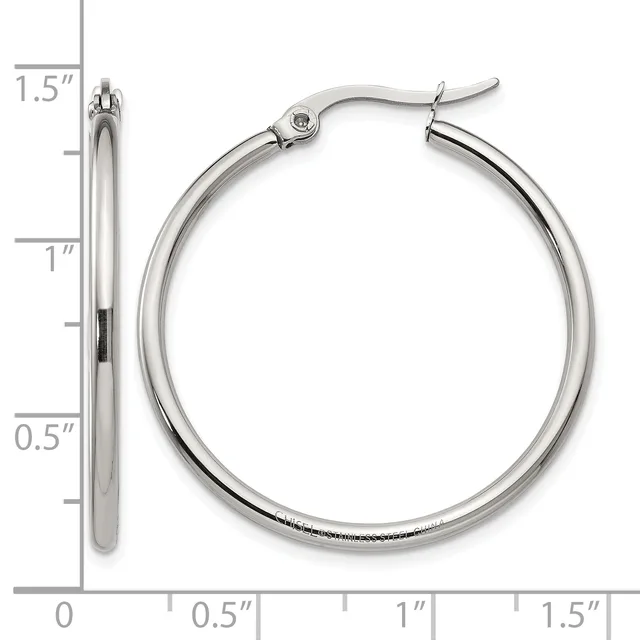 A pair of silver-toned hoop earrings with a polished finish and hinged closures, shown at actual size with a measurement scale indicating they are approximately 1.5 inches in diameter.