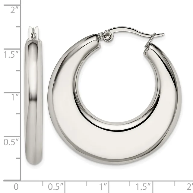 Polished silver-tone chunky hoop earrings with hinged posts, displayed on a measurement scale showing approximately 1.5 inches in diameter and 0.5 inches in width.