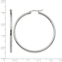 Silver-toned hoop earrings with a hinged clasp, displayed against a ruler showing them to be approximately 2 inches in diameter.