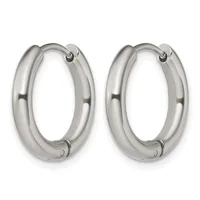 A pair of polished silver-toned chunky oval hoop earrings with hinged closures, displayed side by side against a white background.