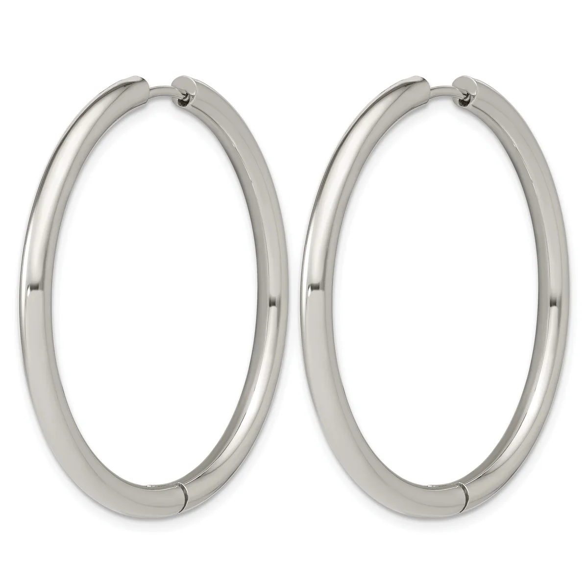 A pair of polished silver-toned hoop earrings with a thick tubular design and hinged closures.